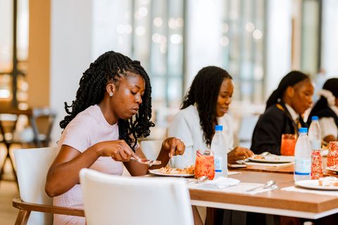 Learners enjoying their meal during the off-campus hotel outing