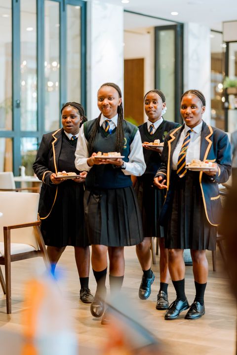 Uniformed learners standing together at the hotel venue