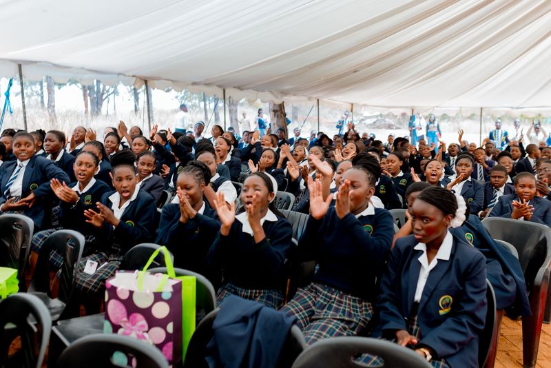 Firm Foundation learners applauding at prize giving
